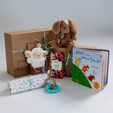 Farm-themed baby gift hamper with soft toy and organic babywear